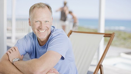 Smiling older man at beach
