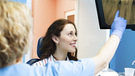 Woman looking at dental x-rays