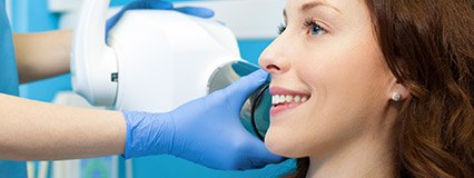 Woman undergoing dental x-rays
